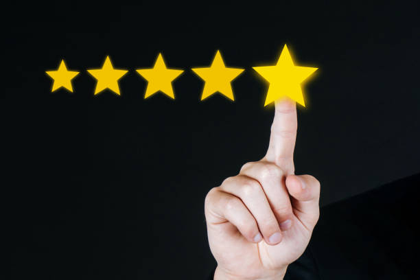 istock Excellent. 5 star rating. business customer hand pressing five star button on visual screen to review good rating on dark background, good experience, positive thinking, customer feedback concept 1317076842