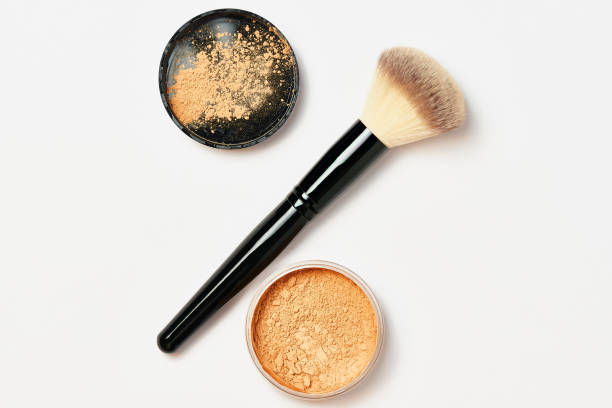 istock Black powder brush with crumbly powder in a jar. 1317077670