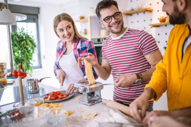 istock Friends preparing italian pasta 1317077768