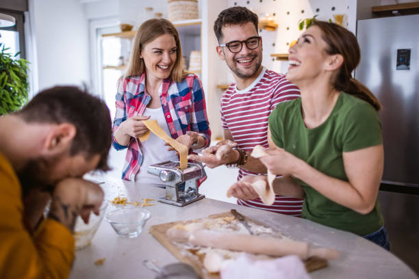 istock Group of friends making homemade pasta 1317078621