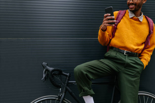 istock Happy Afro man using mobile smartphone outdoors 1317079729