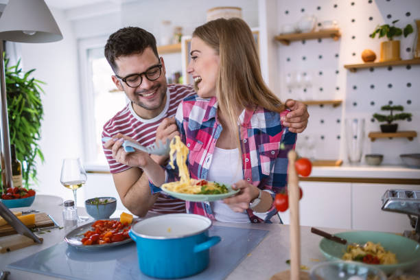 Young Couple Cooking Together