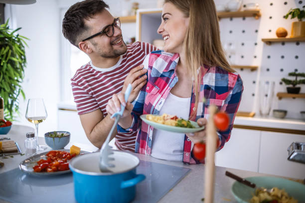 istock Young Couple Cooking Together 1317080335