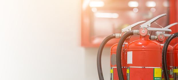 A close up shot of a Japanese fire truck with its hose outlets, levers and buttons to control the water flowing from the truck to put out fires.