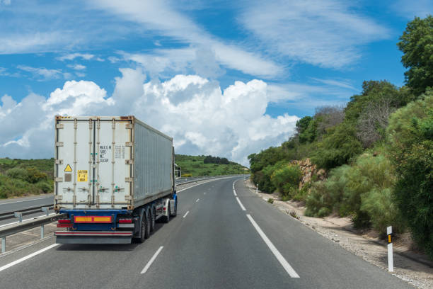 istock Truck transporting a container circulating on the highway. 1317082486