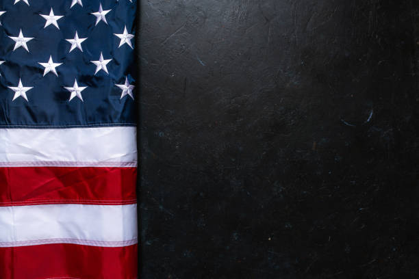 istock Flag of USA on dark background 1317082554