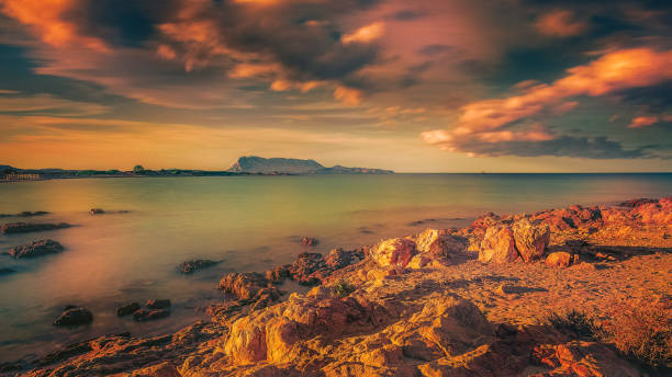 istock Awesome Sunset with dramatic clouds in the sky over sea 1317083868