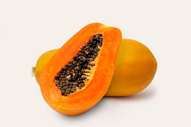 istock papaya fruit with half papaya isolated on white background. 1317085824