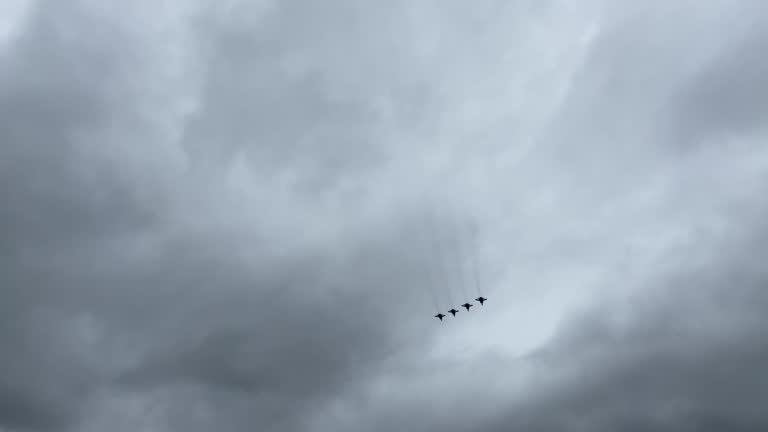 Flying supersonic interceptor aircrafts MIG-31 in dark clouds above Moscow