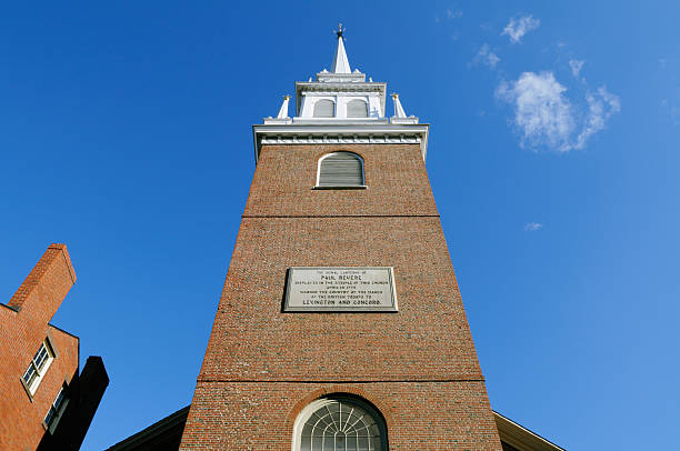 Old North Church Detail Old North Church Tower and Steeple with commemorative plate of Paul Revere actions during American Revolution north end boston photos stock pictures, royalty-free photos & images