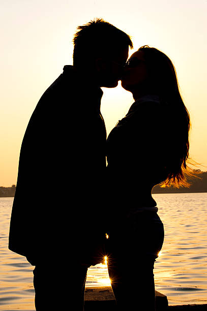 istock silhouette young couple in love 131708932