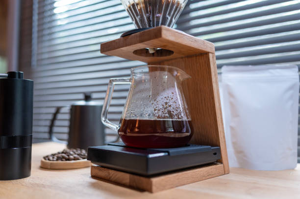 istock Hand drip coffee, Barista making drip coffee with mockup blank package coffee Alternative ways of brewing Coffee shop concept. 1317090105