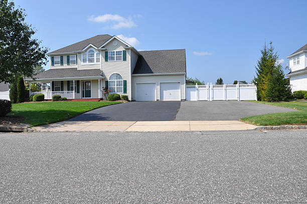 istock Suburban House with Extra Wide Blacktop Driveway 131709035
