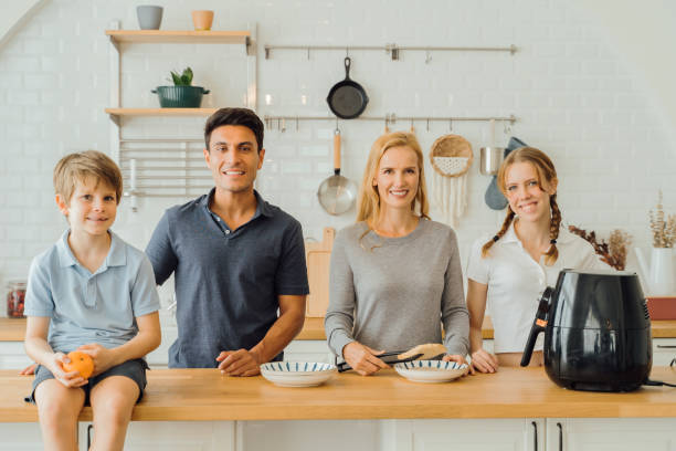 istock Happy family in modern kitchen 1317092089
