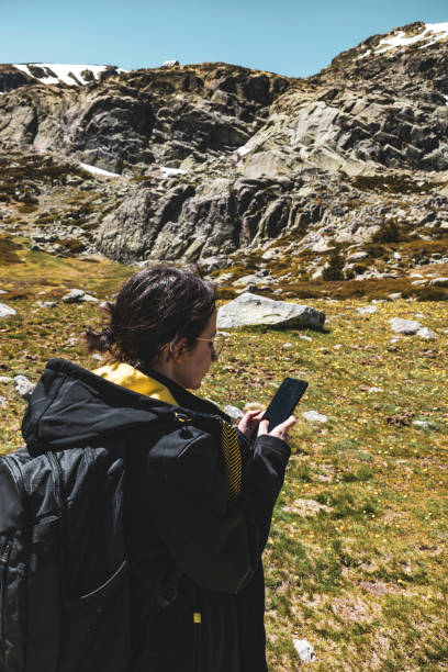 istock Young girl with glasses using smartphone 1317092186
