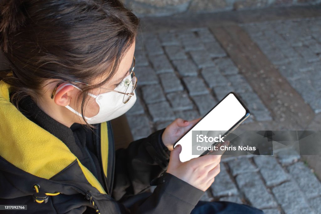 smartphone Woman using her smartphone. Adult Stock Photo