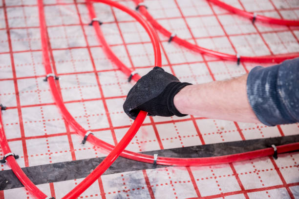 istock Pipefitter install system of underfloor heating system at home 1317093242