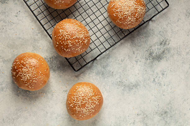 ready-made burger buns on a gray background flat lay. Home cooking