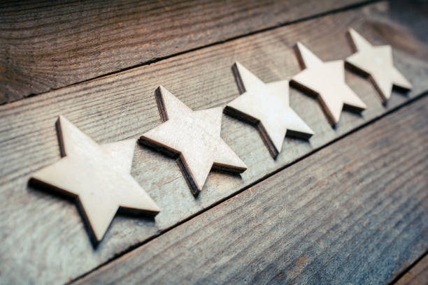 5 Stars Lying On A Wooden Board - Dutch Angle - Quality Concept 5 Stars Lying On Wooden Board - Dutch Angle - Quality Concept testimonial stock pictures, royalty-free photos & images