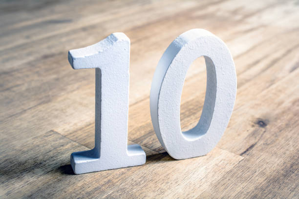 Number 10 Standing On A Brown Wooden Table