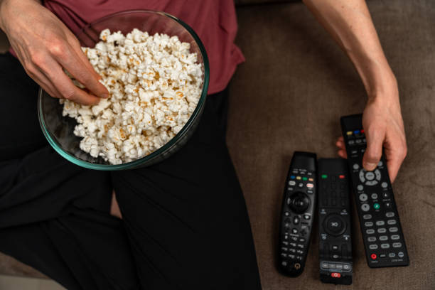 istock remote control and popcorn when watching a movie and broadcasting 1317094349
