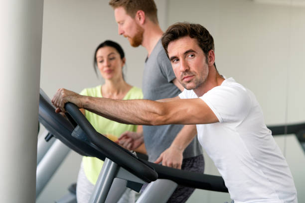 istock Young fit people cardio workout at gym 1317103028
