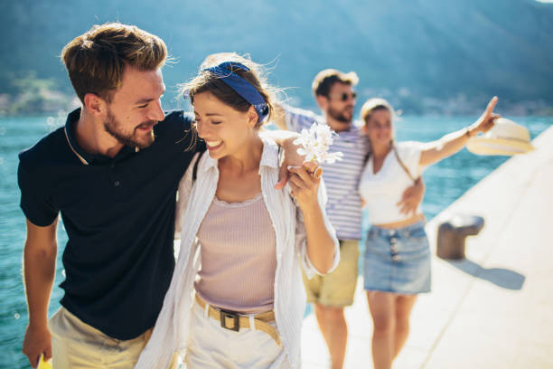 istock Group of friends walking along a beach at summertime. 1317103881