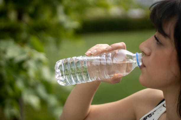 istock Woman drinking water during workout. 1317104340