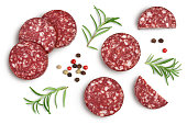 Smoked sausage salami slices isolated on white background with clipping path and full depth of field. Top view. Flat lay