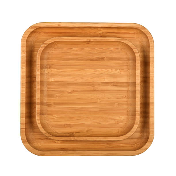 istock Brown wooden tray plates isolated on white 1317105269