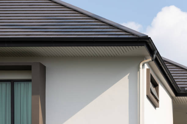 istock rain gutter on the house roof with down pipe. 1317108856