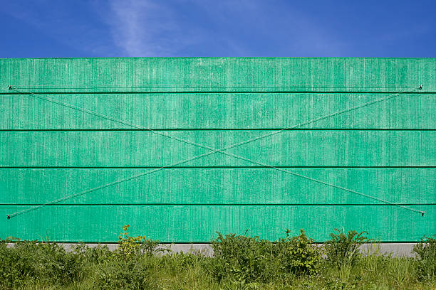 istock Concrete green noise protection wall against blue sky 131710911