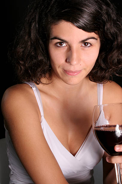 Woman with glass of wine stock photo