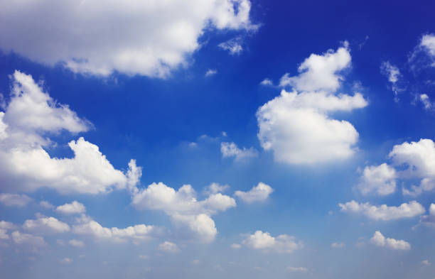 istock beautiful blue sky and white fluffy cloud horizon outdoor for background. 1317112180