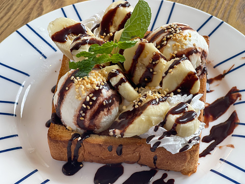 Toast bread topped with banana and ice cream