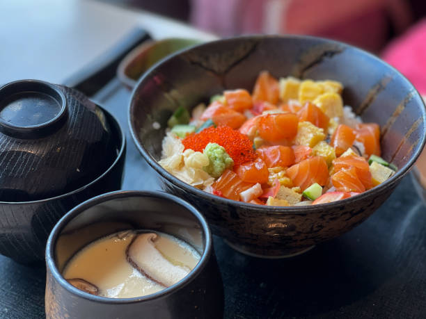 istock Japanese rice bowl topped with salmon sashimi pair with Chawanmushi 1317113633