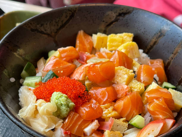 istock Japanese rice bowl topped with salmon sashimi 1317113635