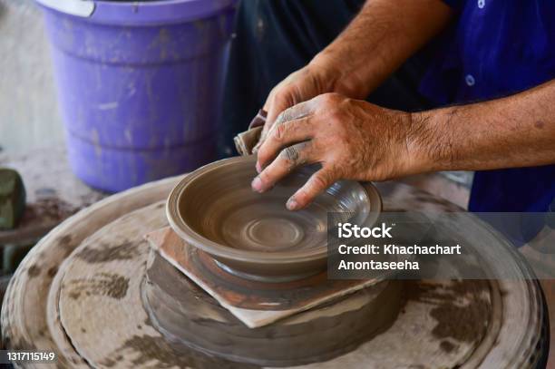 Potter Makes On The Pottery Wheel Clay Pot The Hands Of A Potter With The  Tool Closeup Stock Photo - Download Image Now - iStock