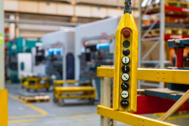 istock Remote control pendant switch for overhead crane in the factory 1317115975