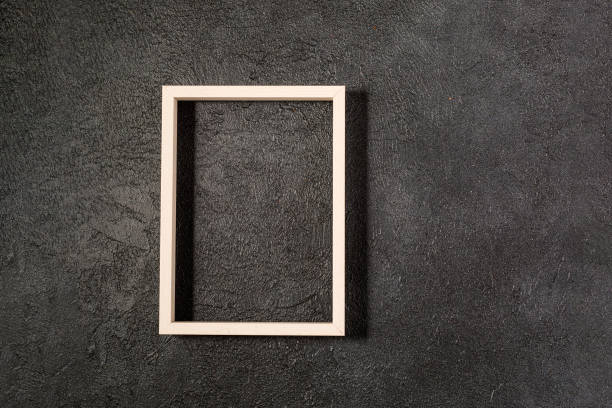 istock Wood frame on black background template for posters and banners 1317119251