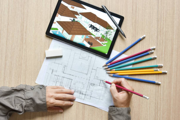 a tablet showing architectural drawing design detail building perspective and draft plan with digital pens on wood table, the concept of new technology for working of tablet with digital pen una tableta que muestra el detalle del diseño del dibujo arquitectónico detalle de la perspectiva del edificio y borrador de plano con plumas digitales en la mesa de madera, el concepto de nueva tecnología para trabajar de la tableta con lápiz digital