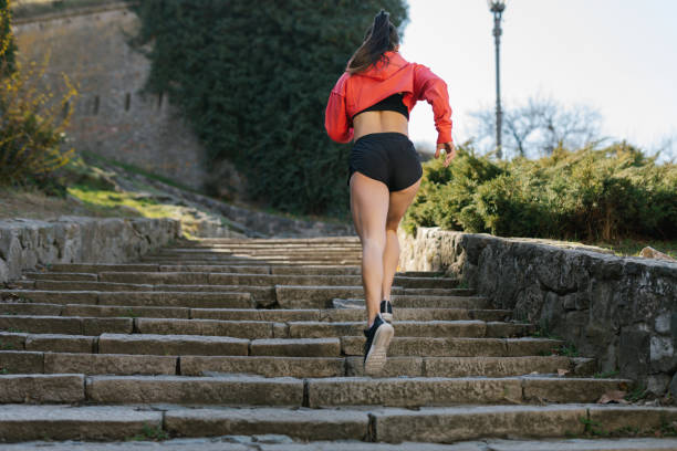 istock Fit woman running outdoors on the stairs 1317124039