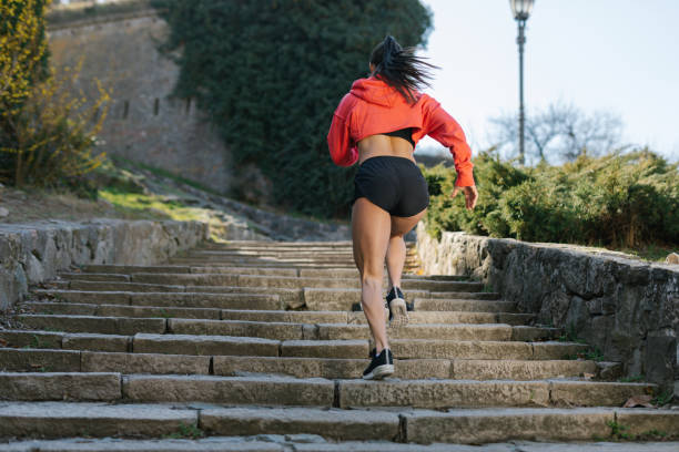 istock Strong woman sprinting on the stairs 1317124055