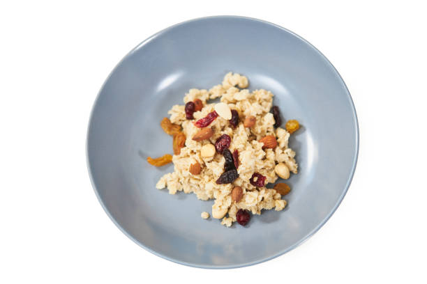 istock Appetizing oatmeal with tasty raisins and nuts. 1317128924