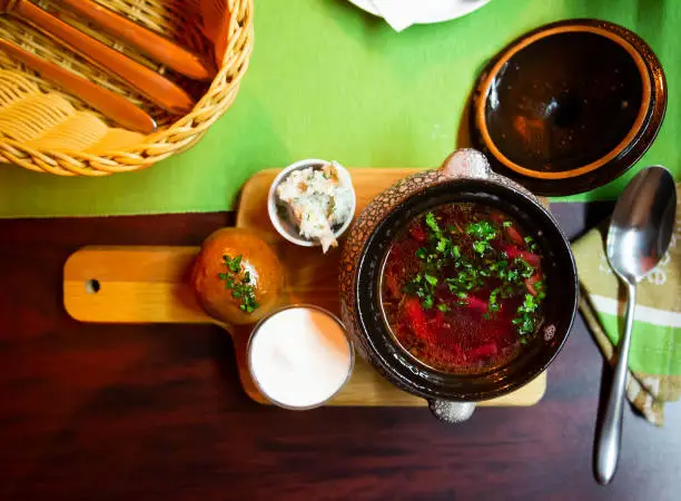 Photo of Red borscht with pampushky, minced salo and sour cream
