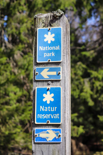 National park sign/ nature reserve sign/ direction arrow\nTyresta national park, along Barnvagnsslingan