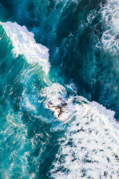 istock Big ocean waves hitting a coral reef. View from above. 1317134889