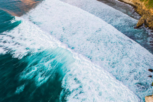 istock Big ocean waves hitting a coral reef. View from above. 1317134890