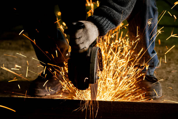 Cutting with grinding wheel Cutting with grinding wheel grinding metal power work tool stock pictures, royalty-free photos & images