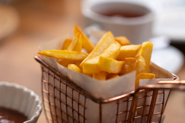 istock French fries on table background 1317136697